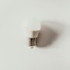A minimalist photo of an LED light bulb against a white background emphasizing simplicity and modern design.